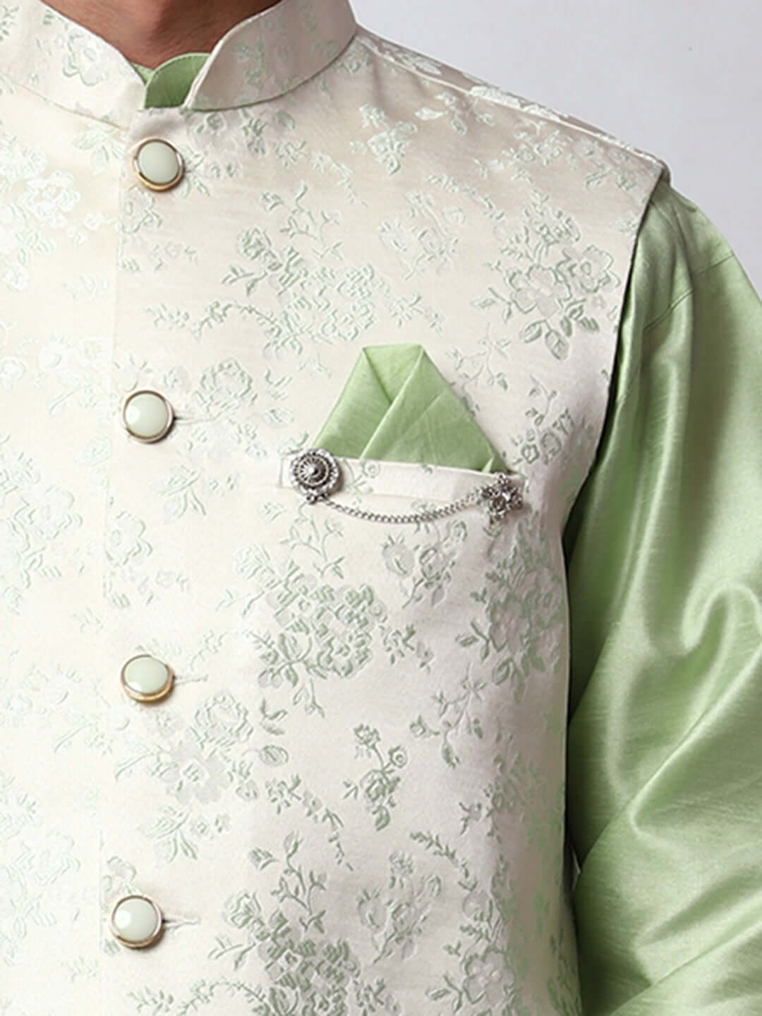 Pista Green kurta with white nehru jacket for men which is made up of jacquard and has floral embroidery on it. Shop this pista green designer wedding kurta jacket set for male from Crease India website.