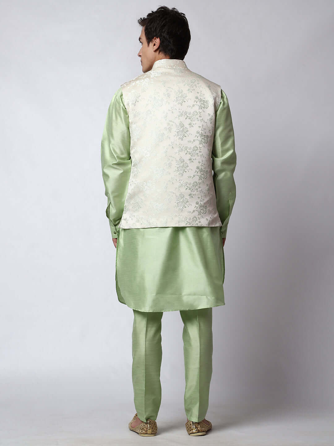 Pista Green kurta with white nehru jacket for men which is made up of jacquard and has floral embroidery on it. Shop this pista green designer wedding kurta jacket set for male from Crease India website.