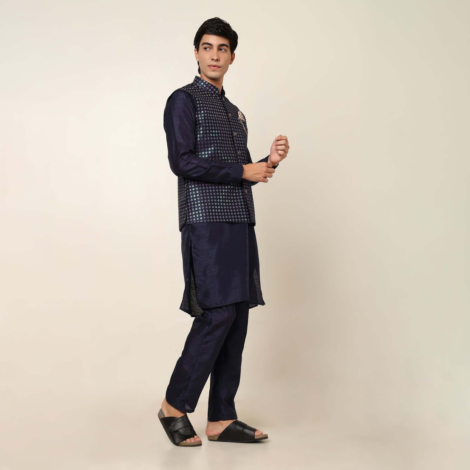 Evening Blue kurta with nehru jacket for men which is made up of dupion silk and has sequence embroidery on it. Shop this evening blue designer wedding kurta jacket set for male from Crease India website.