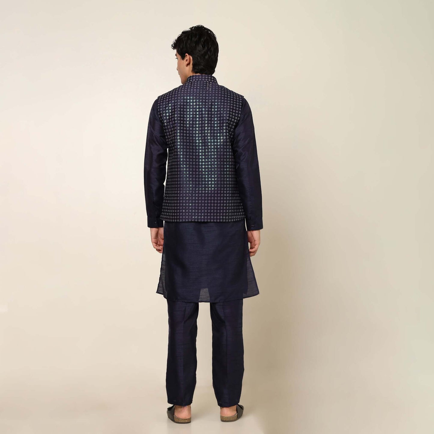 Evening Blue kurta with nehru jacket for men which is made up of dupion silk and has sequence embroidery on it. Shop this evening blue designer wedding kurta jacket set for male from Crease India website.