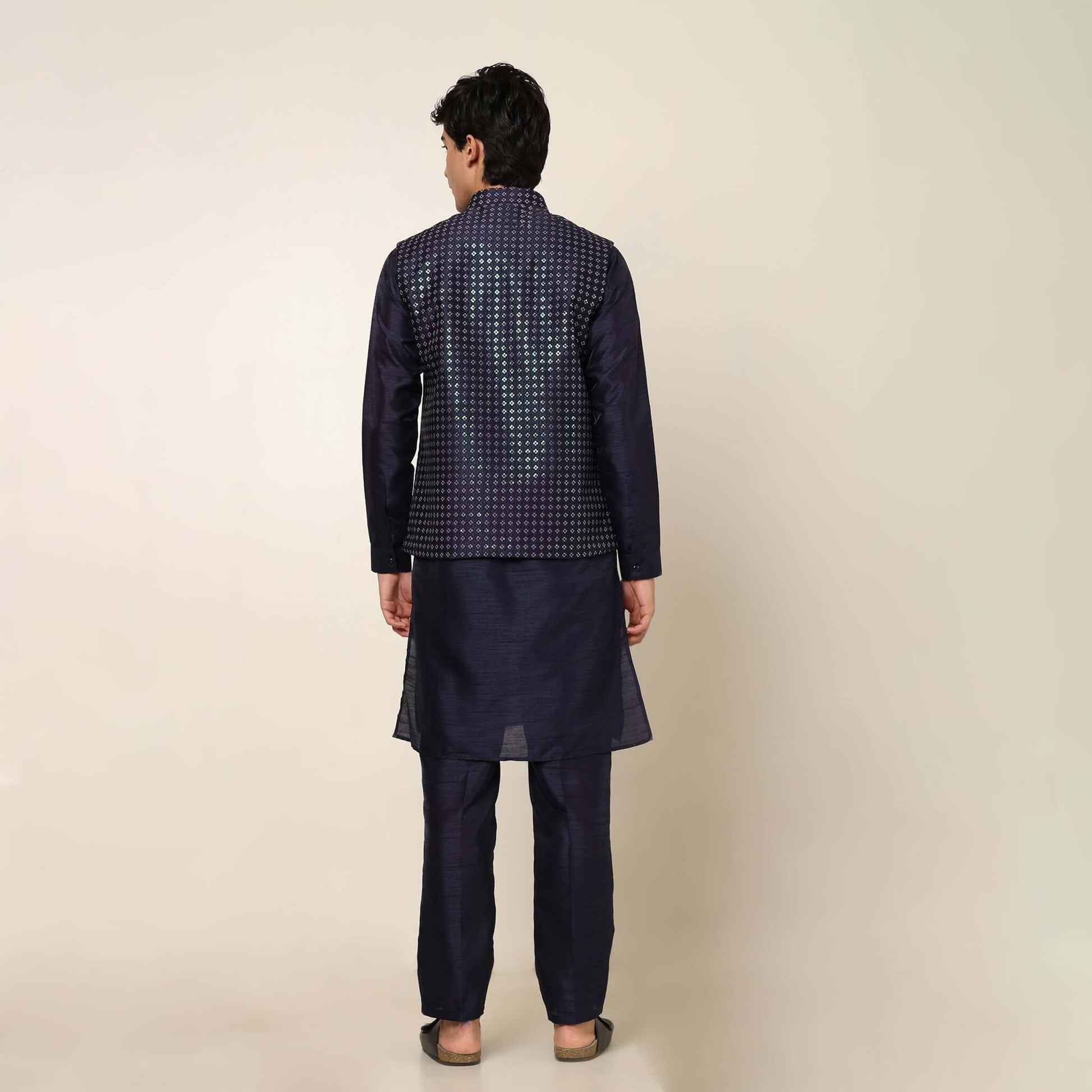 Evening Blue kurta with nehru jacket for men which is made up of dupion silk and has sequence embroidery on it. Shop this evening blue designer wedding kurta jacket set for male from Crease India website.