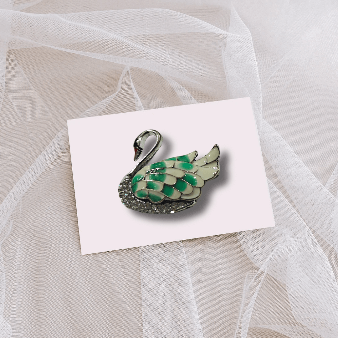 Men's Swan Brooch Lapel Pin for Tuxedos Suits Blazers and Kurtas displayed on soft fabric.