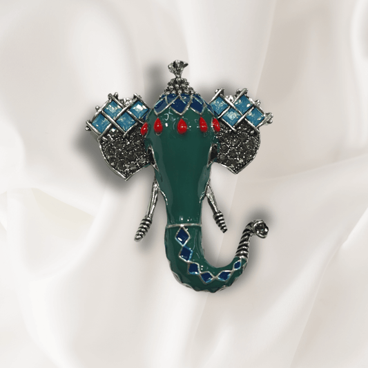 Men's Green Ganesha Brooch Lapel Pin featuring intricate enamel detailing on a silk background.