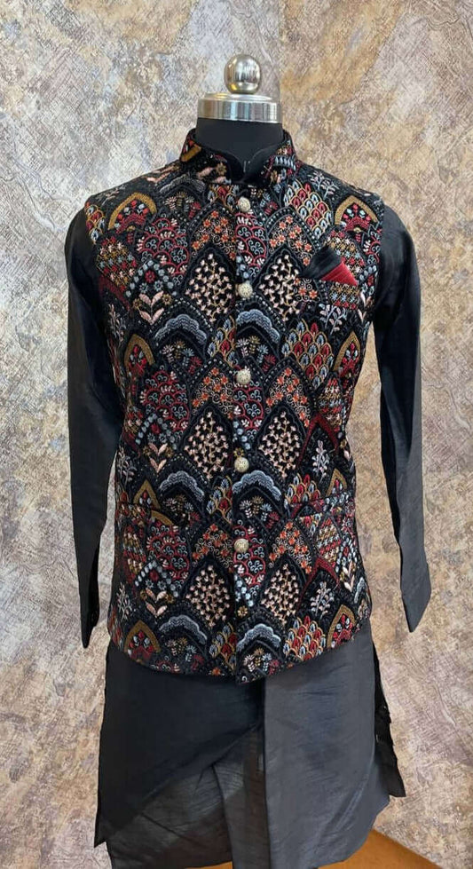 Black kurta with nehru jacket for men which is made up of velvet and has multicolored floral embroidery on it. Shop this black designer wedding kurta jacket set for male from Crease India website.