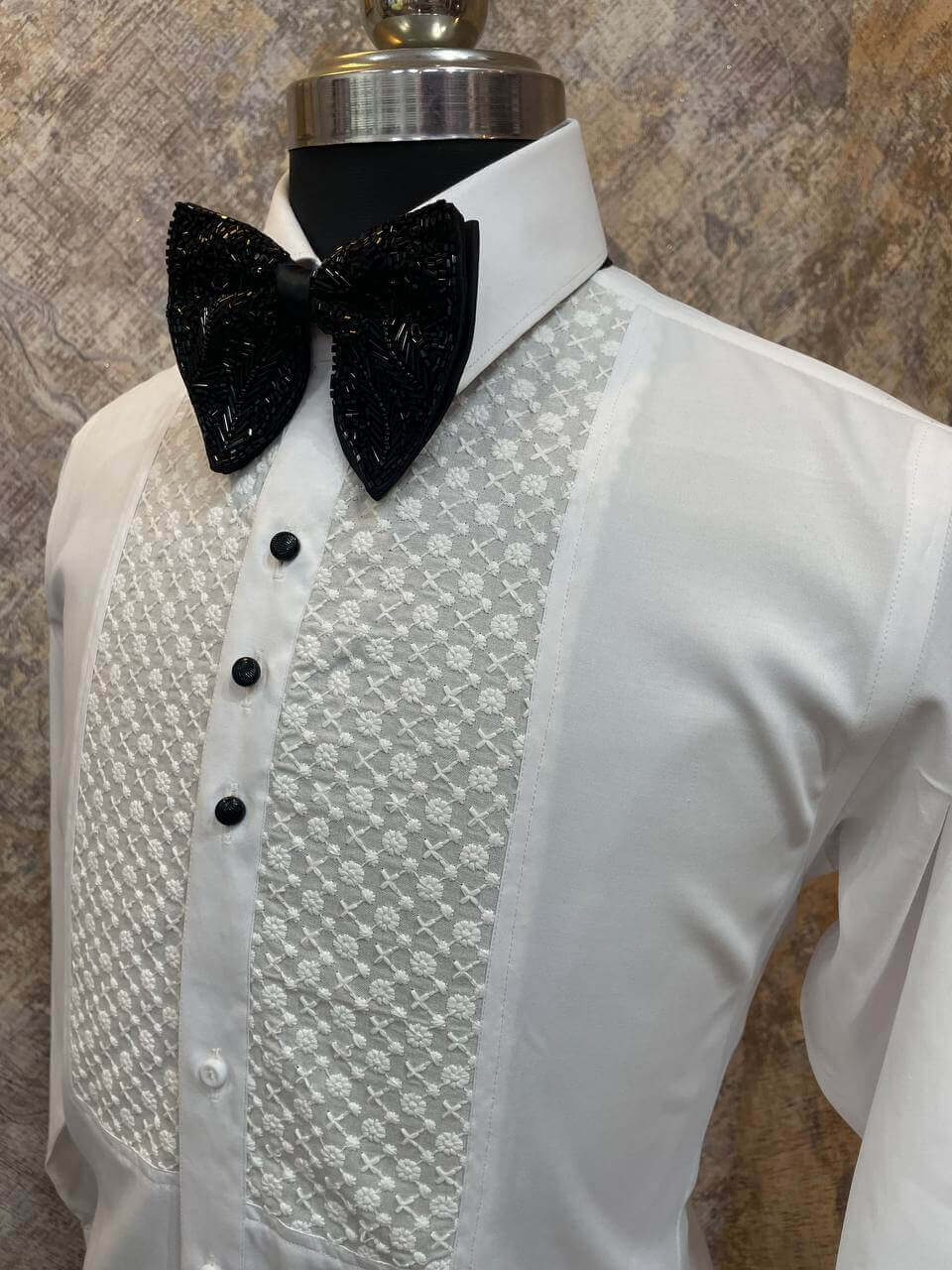 Chikankari Designer White Tuxedo Shirt for Men which is made up of cotton and has chikankari work at the front. Perfect designer formal wear white shirt for weddings and black tie events by Crease India.