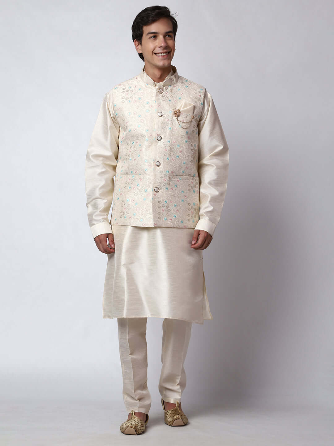Cream kurta with nehru jacket for men which is made up of dupion silk and has multicolored thread embroidery on it. Shop this cream designer wedding kurta jacket set for male from Crease India website.