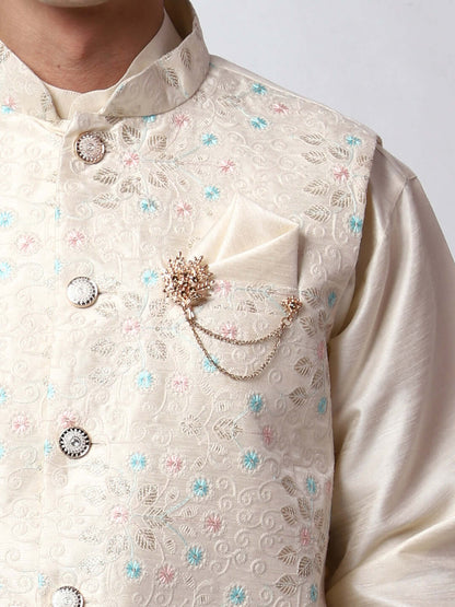 Cream kurta with nehru jacket for men which is made up of dupion silk and has multicolored thread embroidery on it. Shop this cream designer wedding kurta jacket set for male from Crease India website.