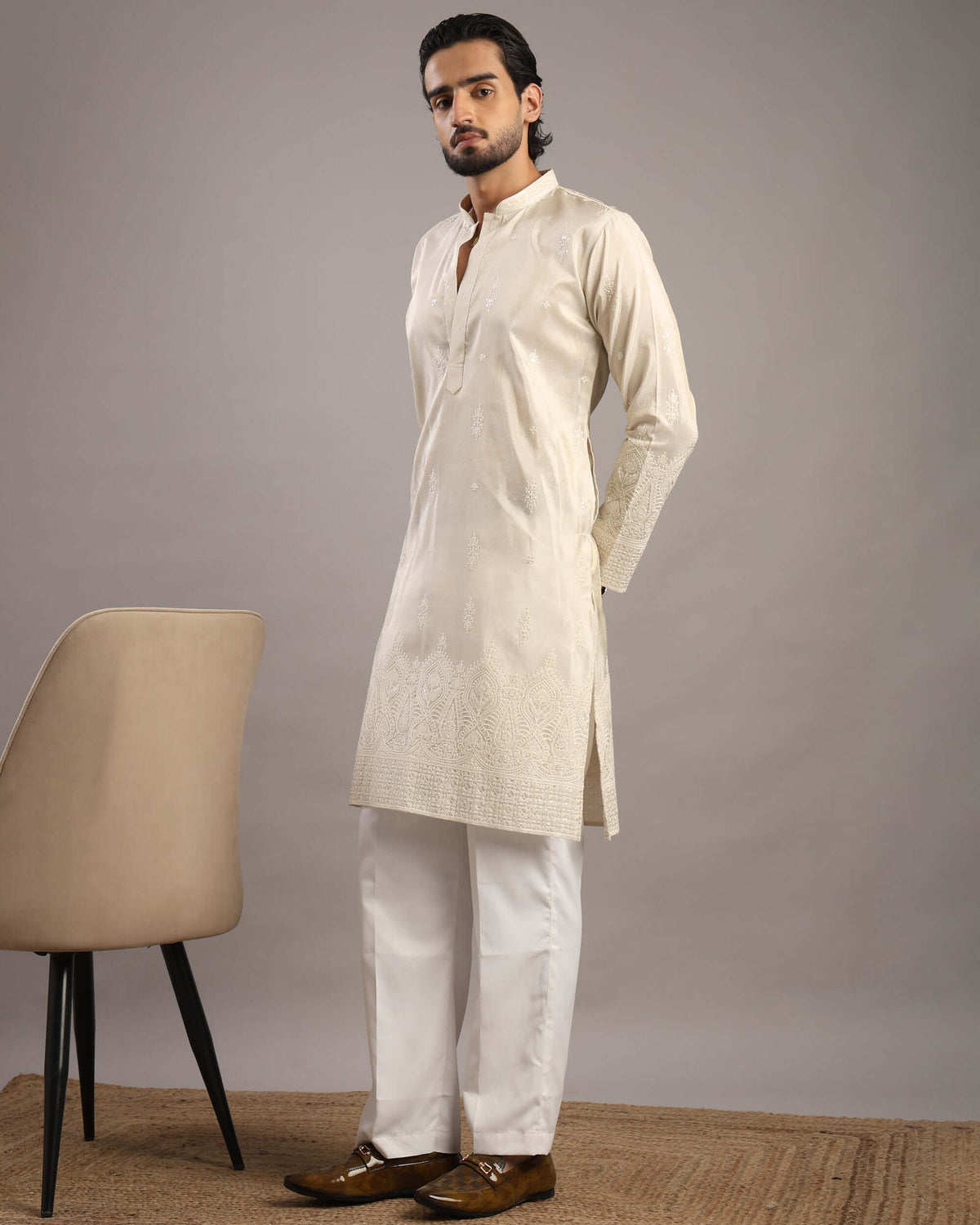 Model looking front wearing Men’s Cream Royale Floral Embroidered Kurta by Crease India