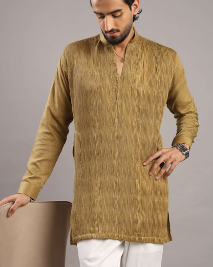 Model looking down pose wearing Men’s Mustard Gold V-Neck Pleated Party Wear Kurta by Crease India
