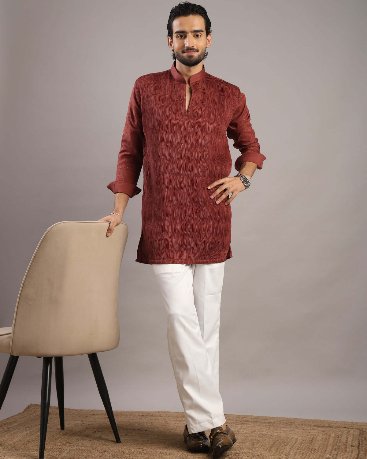 Model lookling in camera wearing Men’s Rust Red V-Neck Pleated Party Wear Kurta by Crease India