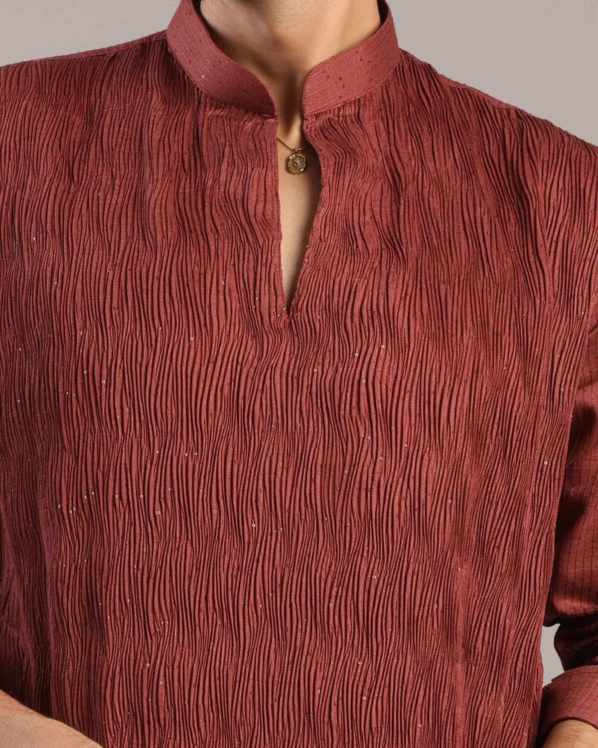 Close-up details of V-neck pleats and sequin accents on Men’s Rust Red Silk Kurta by Crease India
