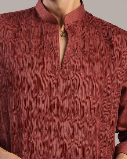 Close-up details of V-neck pleats and sequin accents on Men’s Rust Red Silk Kurta by Crease India
