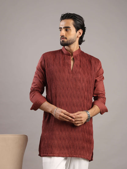 Model looking right wearing Men’s Rust Red V-Neck Pleated Party Wear Kurta by Crease India